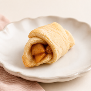 Apple spice croissant on a cream scalloped plate